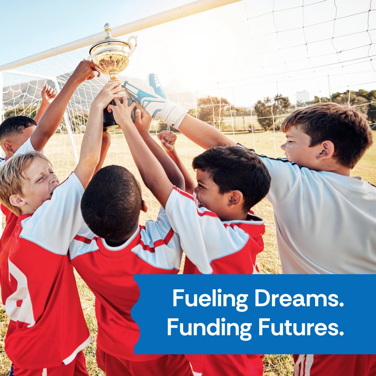 Youth sports team lifting a trophy — Fueling Dreams, Funding Futures
